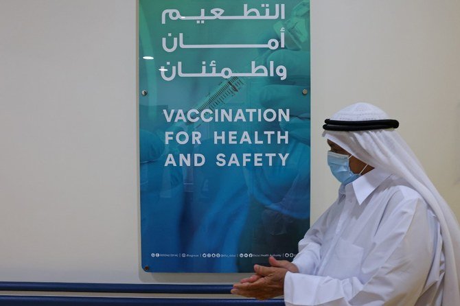 An Emirati man, wearing a protective mask, walks at Al-Barsha Health Centre in Dubai on December 24, 2020. (AFP/File Photo)