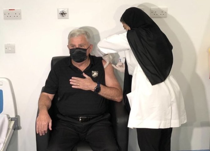 Ambassador John Abizaid receives his second COVID-19 vaccination shot. (US Embassy Saudi Arabia)