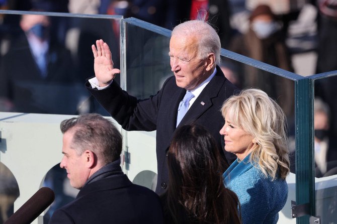 Joe Biden is sworn in as US president as his wife Jill Biden looks on during his inauguration on the West Front of the US Capitol on January 20, 2021 in Washington, DC. (AFP / POOL / Tasos Katopodis)