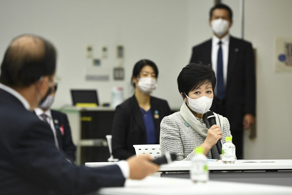 Tokyo Governor Yuriko Koike (R) delivers a speech during an opening plenary session of the three-party meeting on Tokyo 2020 Games additional costs due to the impact of the COVID-19 pandemic in Tokyo on December 4, 2020. (AFP)