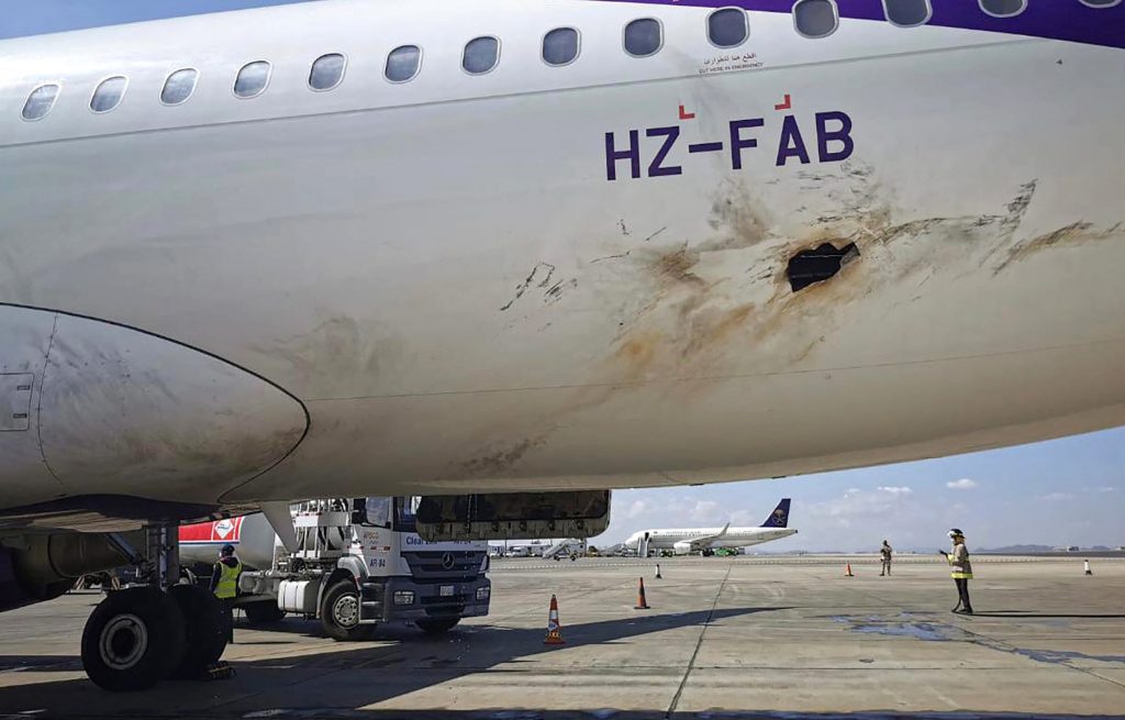 This handout image provided by Saudi Arabia's Ministry of Media on February 10, 2021 reportedly shows a view of the damaged hull of a Flyadeal Airbus A320-214 aircraft on the tarmac at Abha International Airport in Saudi Arabia's southern Asir province. (AFP)
