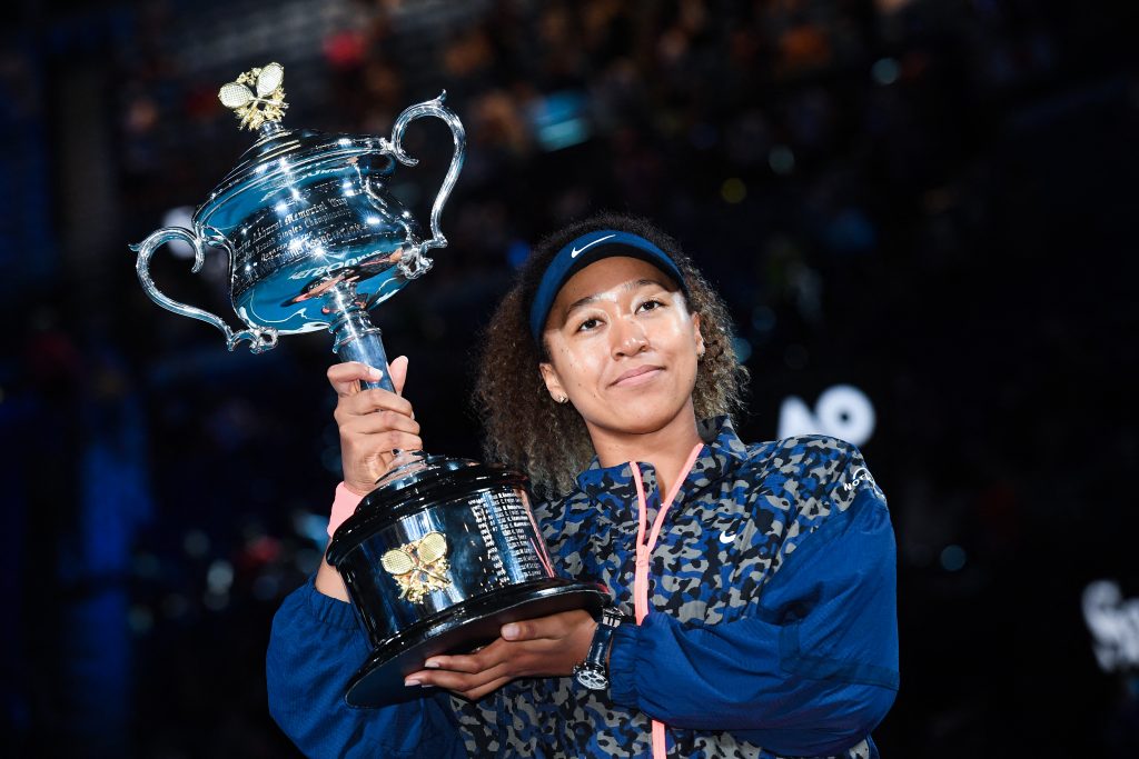 Japan's Naomi Osaka holds the Daphne Akhurst Memorial Cup aloft after defeating United States Jennifer Brady in the women's singles final at the Australian Open tennis championship in Melbourne, Australia, Saturday, Feb. 20, 2021. (AP)
