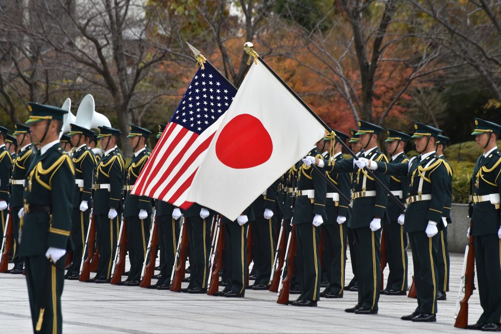 Troops of the Japanese Self Defence Force ceremony corps welcome to US Defense Secretary Ashton Carter during an honour guard prior to talks with Japanese Defence Minister Tomomi Inada at the defence ministry in Tokyo on December 7, 2016. (AFP)