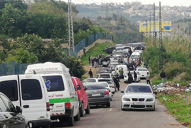 Police gather at the side where the body of anti-Hezbollah journalist and activist Luqman Salim was found in his car. (Reuters)