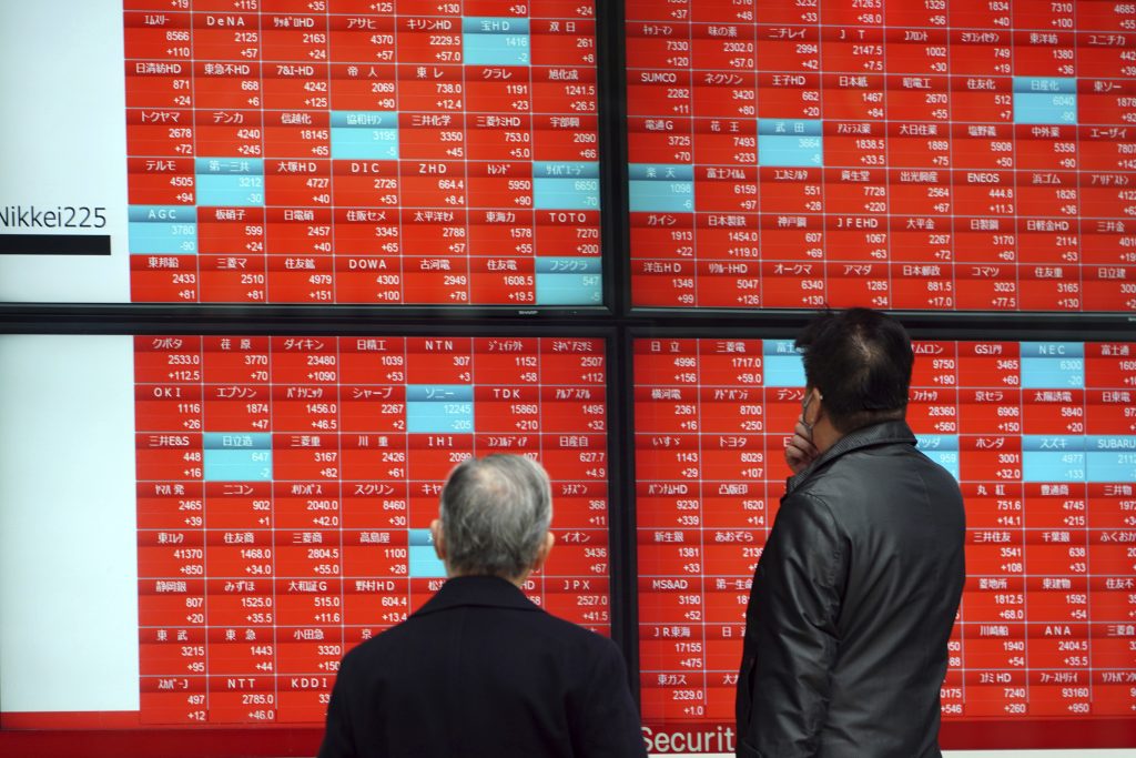 Asian shares mostly rose Monday, tracking a rally on Wall Street last week, with Japan's benchmark momentarily reaching three-decade highs, on growing optimism about the global economy. (File photo/AP)