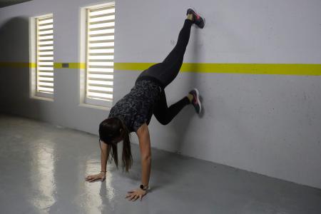 Lebanese trap shooter Ray Bassil exercises in the underground parking of her building. (AFP)