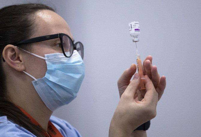 A member of the vaccine team prepares a syringe with a dose of the AstraZeneca/Oxford Covid-19 vaccine. (File/AFP)