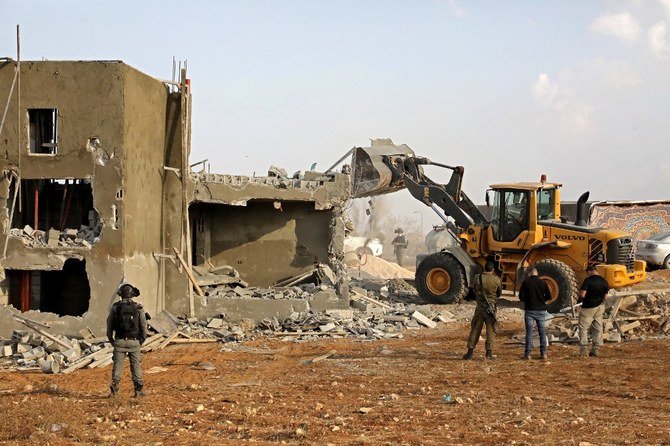 Israeli machinery demolish a Palestinian house in a village south of Yatta in the southern area of the West Bank town of Hebron on Nov. 2, 2020. (AFP file photo)