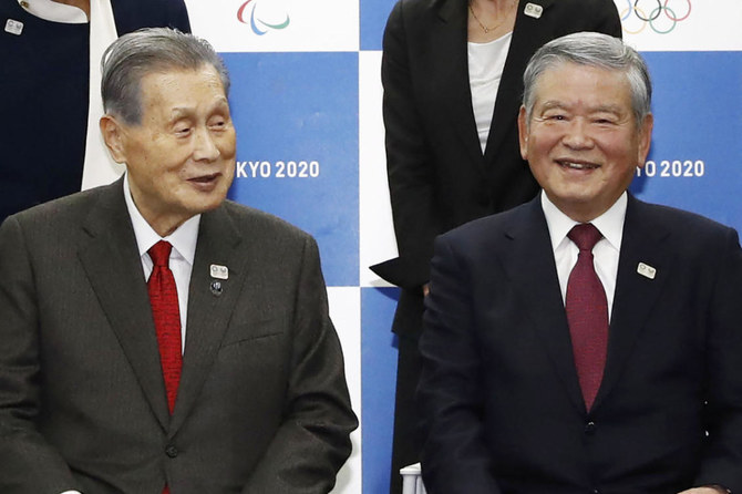 Yoshiro Mori, left, president of Tokyo Olympic organizing committee, and Saburo Kawabuchi, a former president of the Japanese soccer association, attend a press conference in Tokyo on Feb. 3, 2020 as Kawabuchi was appointed as the mayor of the Tokyo Olympic and Paralympic athletes' village. (Meika Fujio/Kyodo News via AP)