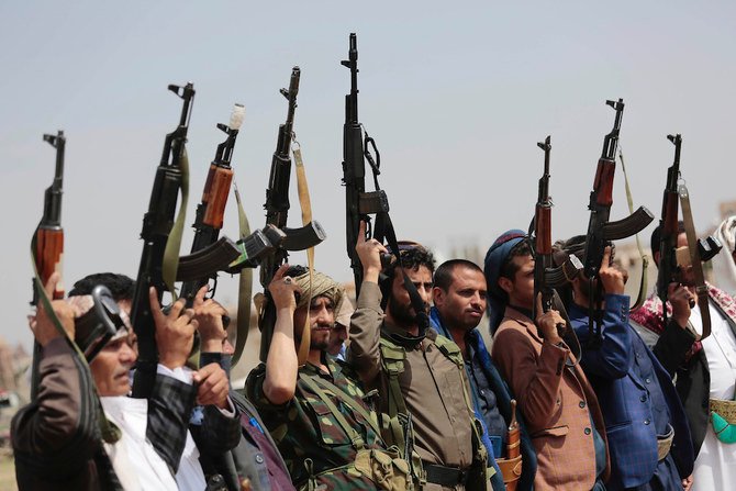In this Saturday, Aug. 22, 2020 file photo, tribesmen loyal to Houthi militants raise their weapons during a gathering against the agreement to establish diplomatic relations between Israel and the United Arab Emirates in Sanaa, Yemen. (AP)