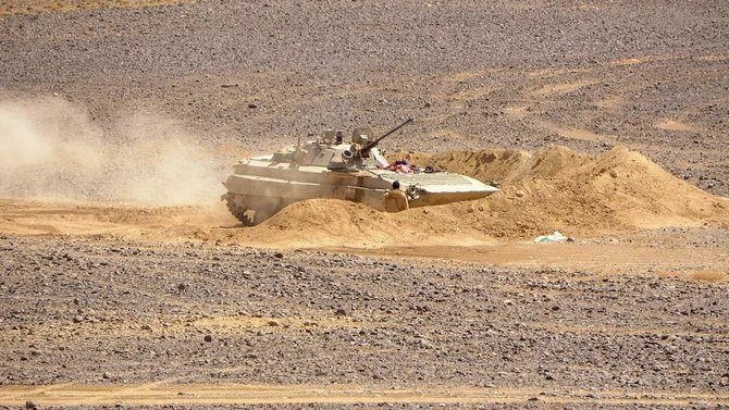 Arab coalition forces get into position during clashes with the Iran-backed Houthi militia in Al-Jadaan area about 50 kilometers northwest of Marib in central Yemen on Feb. 11, 2021. (AFP)