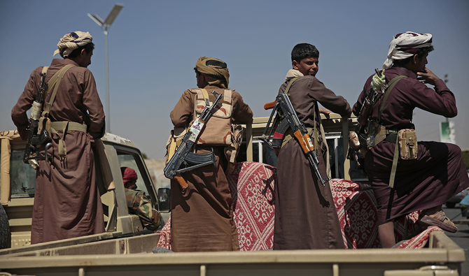 Houthi rebels ride on a vehicle during a funeral procession for Houthi fighters who were killed in recent fighting with forces of Yemen's Saudi-backed internationally recognized government, in Sanaa, Yemen, Tuesday, Feb. 16, 2021. (AP)
