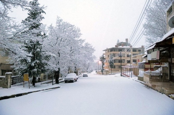 Snow covers a street in the town of Slanfah, in Latakia province, Syria, Wednesday, Feb. 17, 2021. (SANA via AP)