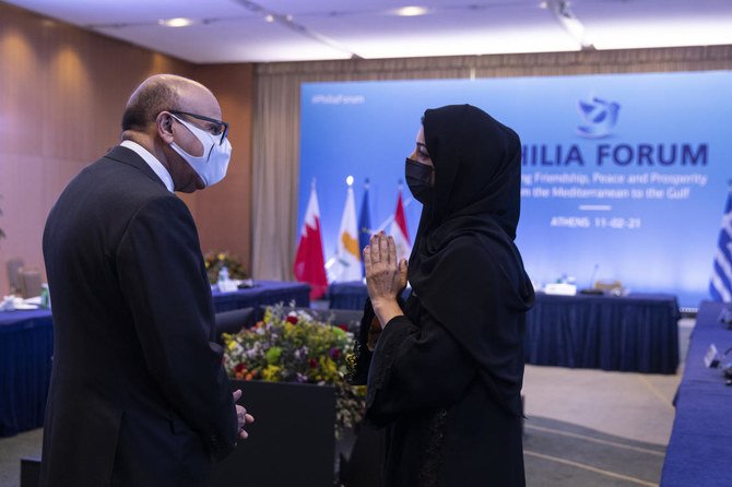 Bahrain's Foreign Minister Abdullatif Al-Zayani (left) speaks with Reem Ebrahim Al-Hashimi, Emirati Minister of State for International Cooperation during a meeting, in Athens, on Thursday, Feb. 11, 2021. (AP)