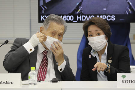 In this Sept. 24, 2020, file photo, then Tokyo 2020 Organizing Committee President Yoshiro Mori (left) talks with Minister for the Tokyo Olympic and Paralympic Games Seiko Hashimoto after opening remarks session of an on-line meeting focused on how to pull off the delayed Tokyo Games, in Tokyo. (AP)
