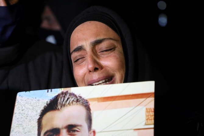A relative of one of the victims of Beirut port explosion, reacts during a protest, after a Lebanese court removed the judge leading the investigation into the explosion, outside the Justice Palace in Beirut, Lebanon February 18, 2021. (Reuters)