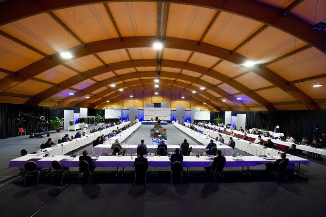 Delegates attend a vote for the new interim government during a meeting of the Libyan Political Dialogue Forum near Geneva on February 5, 2021. (AFP)