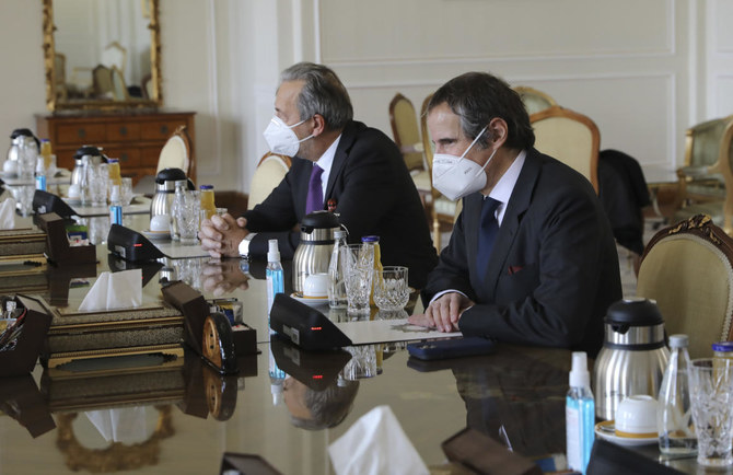 Director General of International Atomic Energy Agency, IAEA, Rafael Mariano Grossi, right, looks towards Iranian Foreign Minister Mohammad Javad Zarif during a meeting, in Tehran, Iran, Sunday, Feb. 21, 2021. (AP Photo)