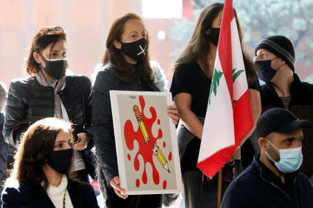 Activists gather two days after the killing of prominent Hezbollah critic Luqman Slim demanding a transparent investigation into the crime, in downtown Beirut, Lebanon, February 6, 2021. (Reuters)