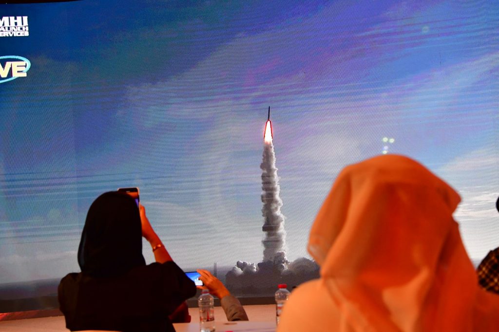 Above, a screen broadcasts the launch of the Hope Mars probe at the Mohammed Bin Rashid Space Centre in Dubai on July 19, 2020. The probe entered into Mars’ orbit on Feb. 9, 2021. (AFP)