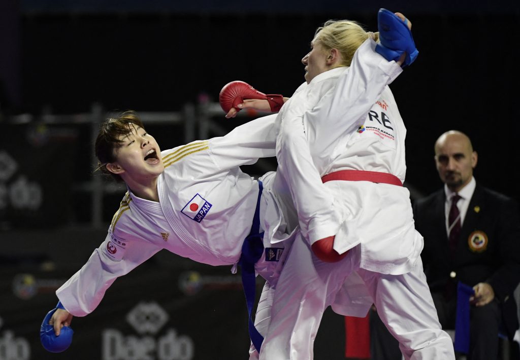 Japanese karateka Ayumi Uekusa (L) competes for the Gold Medal with Greek karateka Eleni Chatziliadou during the Kumite female +68kg final competition of the 24th Karate World Championships at the WiZink center in Madrid on November 10, 2018. (AFP)