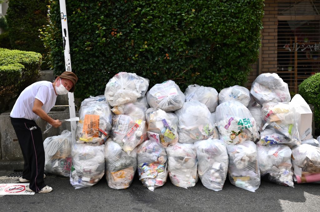 Many municipalities have also switched to a system in which garbage is collected in front of each home, rather than at a conventional collection point for multiple households, so that it will be easier for elderly residents to put out garbage. (AFP)