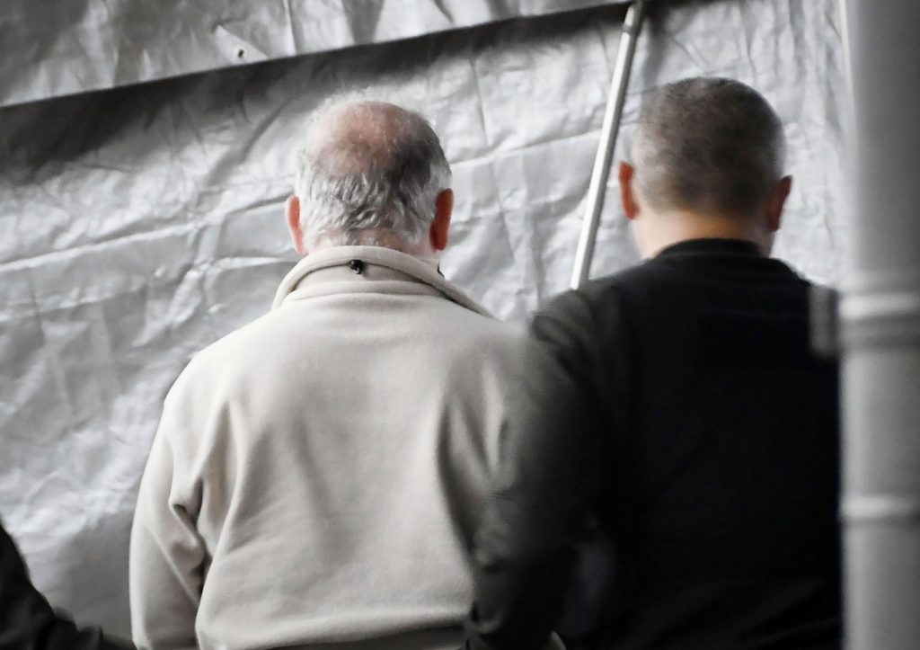 A man, who appears to be Michael Taylor (L), arrives at Narita Airport in Narita, east of Tokyo, March 2, 2021. (File photo/Kyodo News via AP)