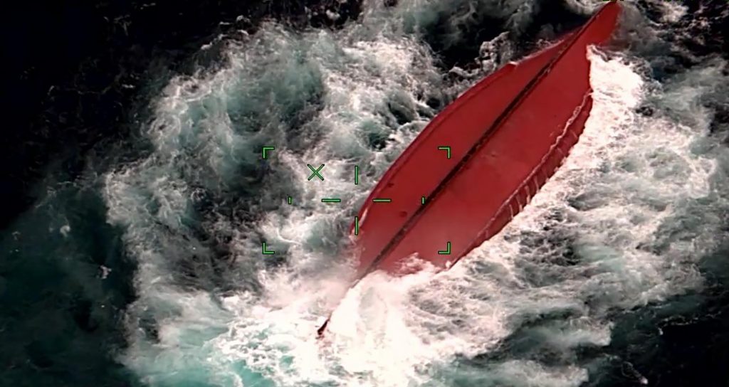 Image taken by camera mounted on aircraft and released by the 11th Regional Japan Coast Guard Headquarters shows a Chinese fishing boat capsized off Ishigaki Island, Okinawa prefecture, southern Japan, March. 2, 2021. (File photo/The 11th Regional Japan Coast Guard Headquarters via AP)