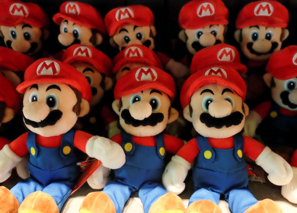 Stuffed Mario toys are displayed at 1Up Factory inside Super Nintendo World. (Reuters)