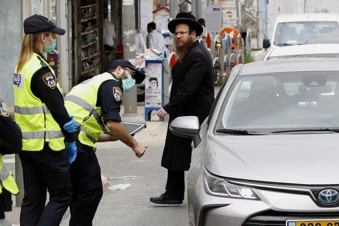 The country’s “traffic system” has identified “green” cities as those with lowest COVID-19 cases, while the second lowest infection rates are “yellow,” followed by “orange” and “red.” (File/AFP)