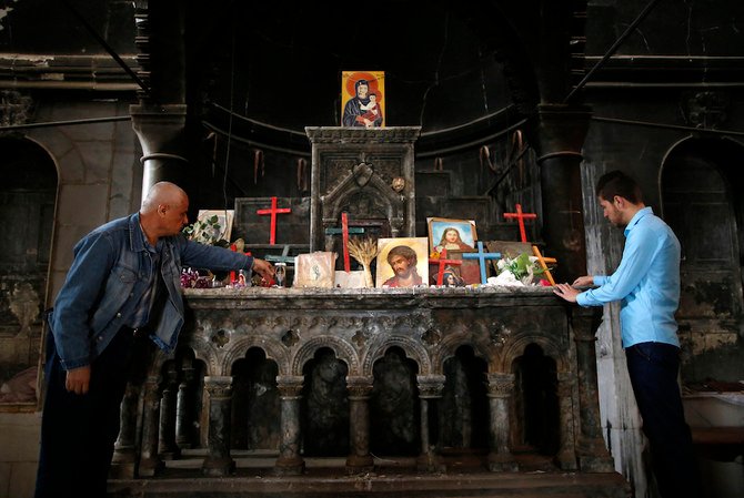 Iraqi Christians of Qaraqosh attend the first Palm Sunday service at the heavily damaged Church of the Immaculate Conception on April 9, 2017, since Iraqi forces recaptured it from Daesh. (AFP/File Photo)