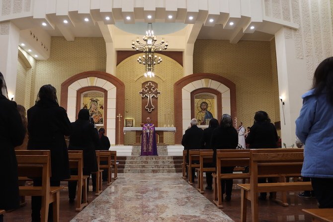 Nashwan Hanna gives a sermon at Mar Elia Chaldean Catholic Church in the Christian-majority neighborhood of Ankawa, Irbil. (Kareem Botane)