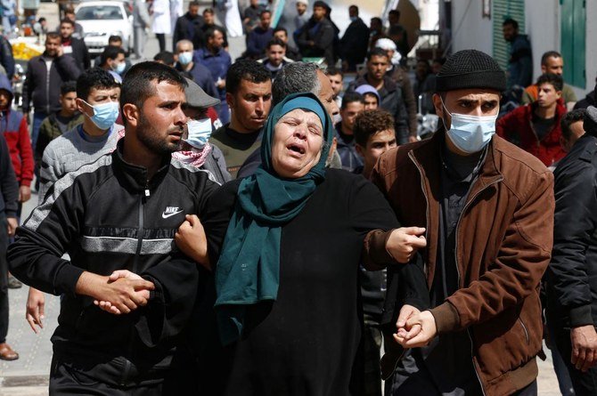 The mother of one of three fishermen killed when their boat exploded off Gaza’s coast, reacts outside Nasser Hospital in Khan Yunis in the southern Gaza Strip, on March 7, 2021. (AFP)