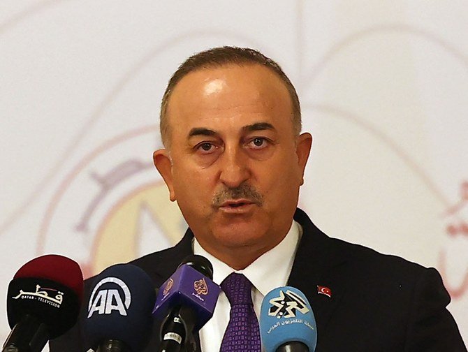 Turkish Foreign Minister Mevlut Cavusoglu attends a joint press conference following a tripartite meeting with his Russian and Qatari counterparts, on March 11, 2021 in Doha. (File/AFP)