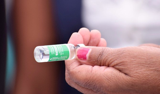 A nurse holds a bottle of a dose of Oxford/AstraZeneca vaccine at Scott Hospital in Maseru on March 10, 2021. (AFP)