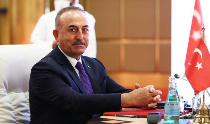 Turkey's Foreign Minister Mevlut Cavusoglu attends a meeting with Qatar's Deputy Prime Minister and Minister of Foreign Affairs Mohammed bin Abdulrahman Al Thani and Russia's Foreign Minister Sergei Lavrov in Doha, Qatar March 11, 2021. (REUTERS)