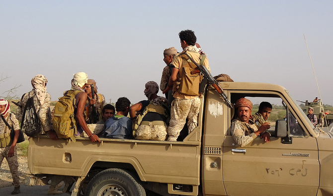 Forces loyal to Yemen's Saudi-backed government enter the Abs district of the northwestern Hajjah province on March 11, 2021. (AFP)