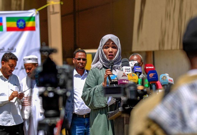 Members representing African communities in Yemen speak in front of the offices of the International Organization for Migration in Sanaa, following last weekend’s fire in a holding facility, on Mar.13, 2021. (AFP)