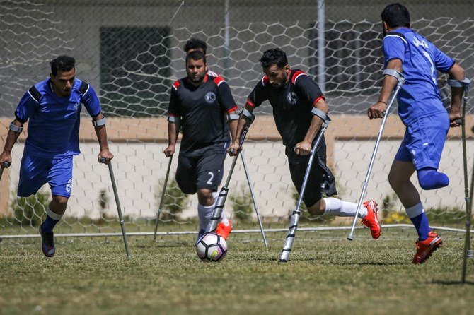 Palestinian players compete during a local football championship for amputees, organised by the International Committee of the Red Cross (ICRC), in Gaza amid coronavirus pandemic. (AFP)