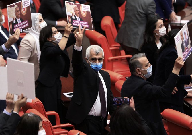 Omer Faruk Gergerlioglu, a human rights advocate and lawmaker from the People’s Democratic Party, reacts after the parliament stripped his parliamentary seat on March 17, 2021. (AP)