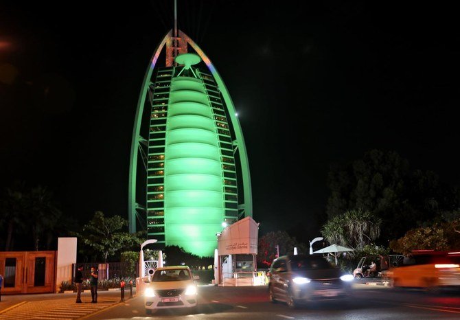 The Burj Al Arab lit up in green for St. Patrick's Day last week. The UAE wants to attract more remote workers. (AP)