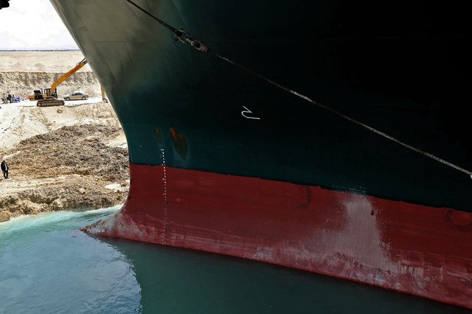 Tugboats and dredgers are working to free the Ever Given container ship blocking Egypt's Suez Canal. (AFP)