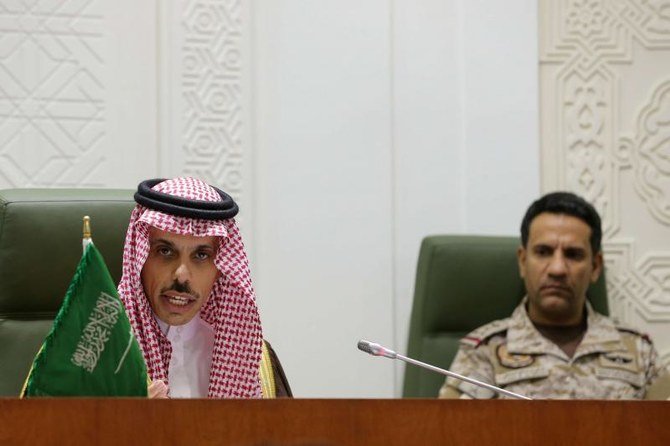 Saudi Foreign Minister Prince Faisal bin Farhan (L) speaks during a press conference in the capital Riyadh on March 22, 2021, announcing an offer of a cease-fire with Yemen’s Houthi militia. (Reuters)