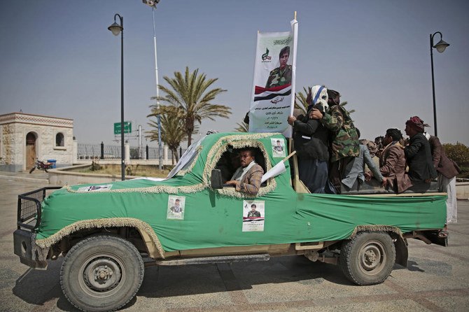 Armed Houthi fighters ride on a vehicle as they attend the funeral procession of Houthi rebel fighters who were killed in recent fighting with forces of Yemen's internationally recognized government in Sanaa, Yemen, Tuesday, Mar. 2, 2021. (AP)