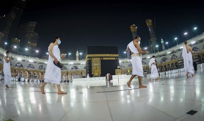 Handout picture provided by the Saudi Ministry of Hajj and Umrah on Oct. 4, 2020, shows Saudis and foreign residents circumambulating the Kaaba in the Grand Mosque complex in the holy city of Makkah. (File/AFP)