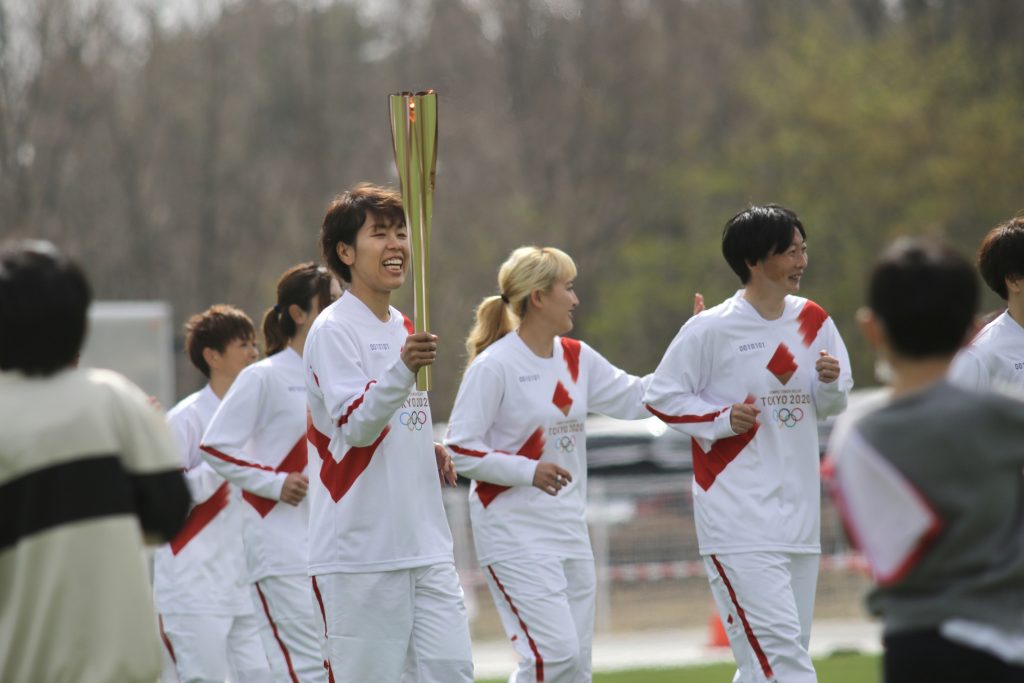 Iwashimizu Azusa of Japan national soccer team (Nadeshiko) is seen being the first to carry the Olympic torch in the relay that kicked off today (March 15) at the J-Village national soccer training center in Fukushima Prefecture, northeastern Japan. (ANJ photo)