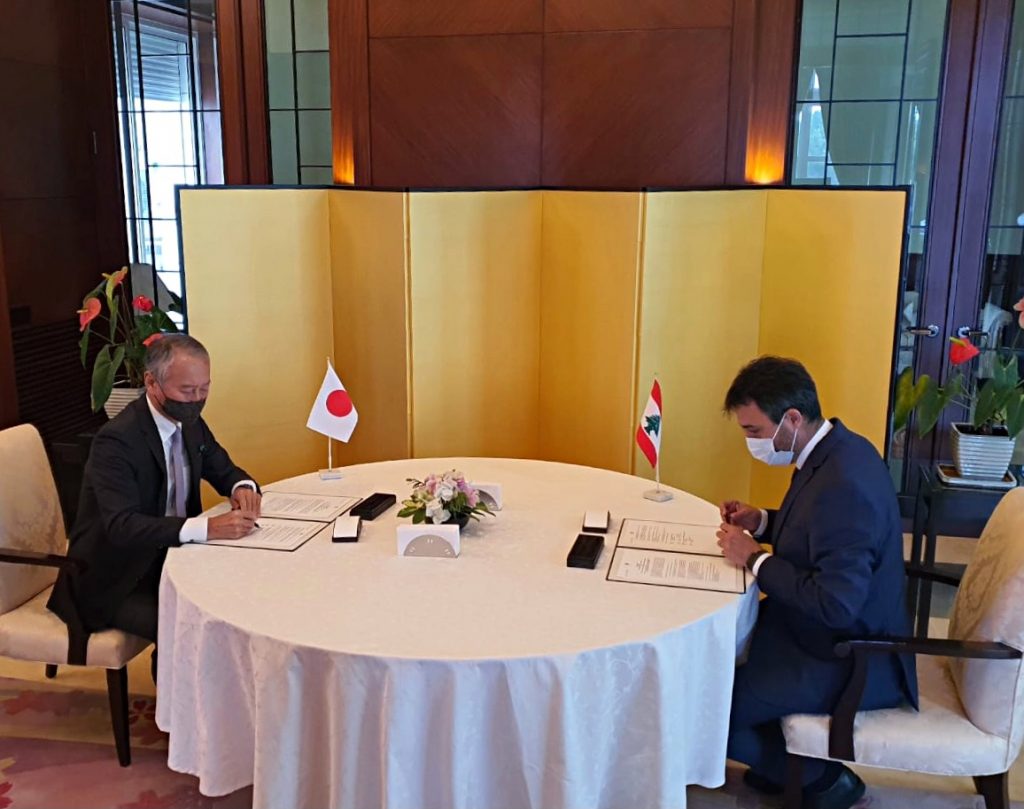 The Japanese Ambassador to Lebanon Okubo Takeshi Okubo and with Serop Ohanian, the Field Director of Lebanon’s Karagheusian Primary Healthcare Center sign a grant contract, March. 3, 2021. (Supplied)