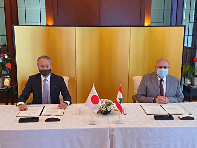 The Japanese Ambassador to Lebanon Okubo Takeshi Okubo  and Dr. Firas Abiad, Chairman of the Board of directors of Rafik Hariri University Hospital sign a grant contract, March. 3, 2021. (Supplied)