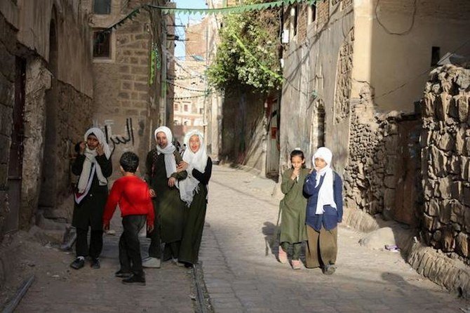 Children walk along a lane in the old quarter of Sanaa, Yemen, March 22, 2021. (Reuters)