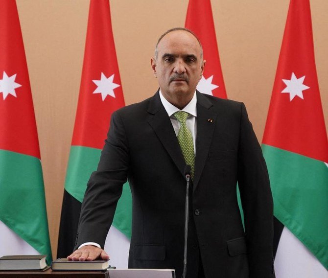 Prime Minister Bisher Al-Khasawneh was appointed last October by King Abdullah to restore public trust over the handling of the coronavirus health crisis, among others. (AFP)